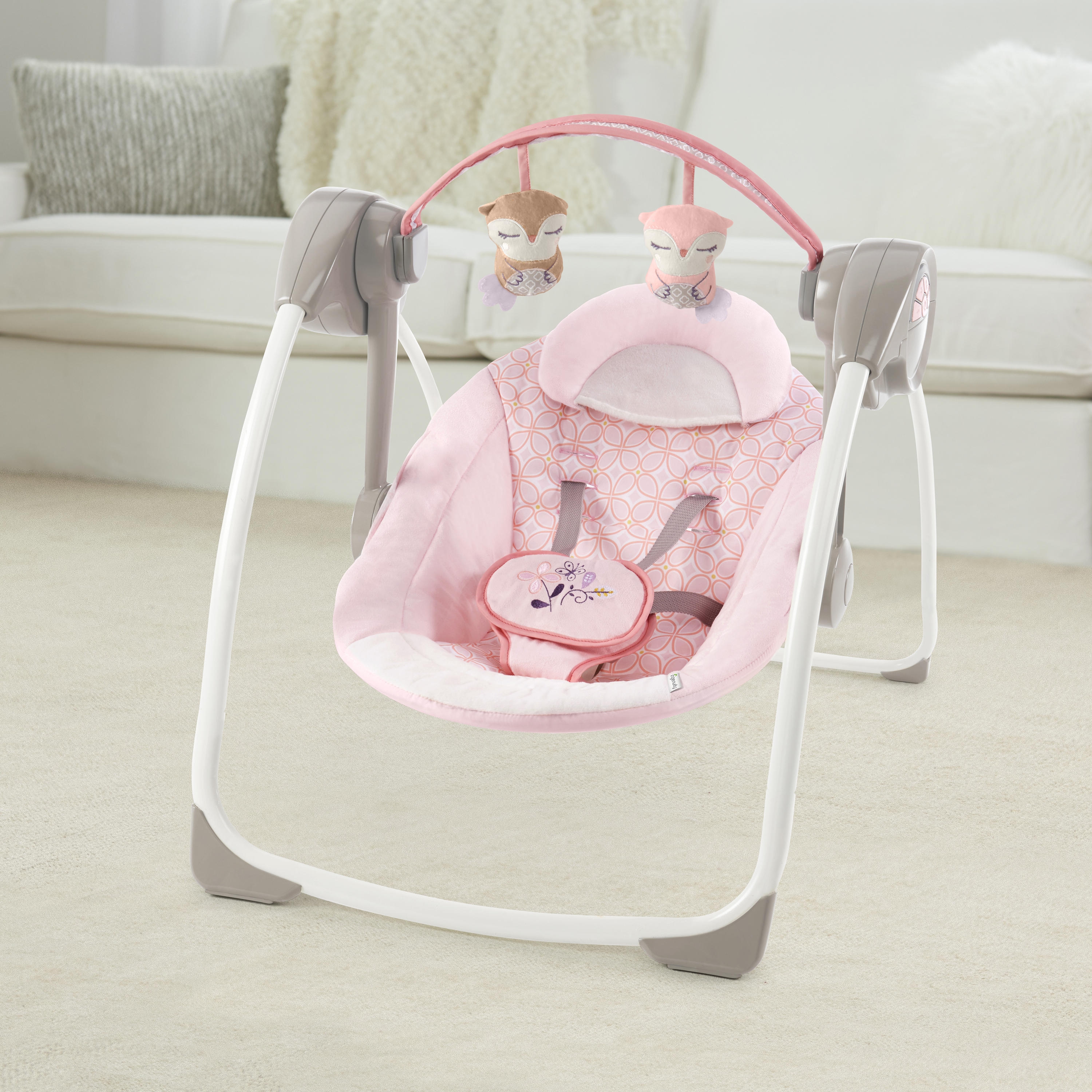 audrey cradling bouncer in pink